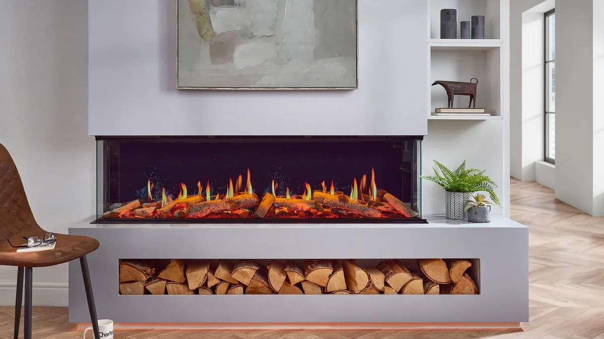 Modern electric fireplace media wall with log storage by Blue Oak Fireplaces in Leicester
